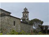 Village church with characteristic dampers on the bells. Also the ropes for ringing are usually just outside in the open